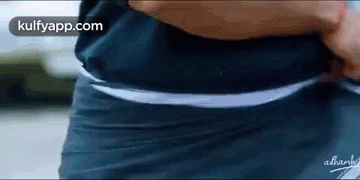 a close up of a person 's waist with a white waistband .