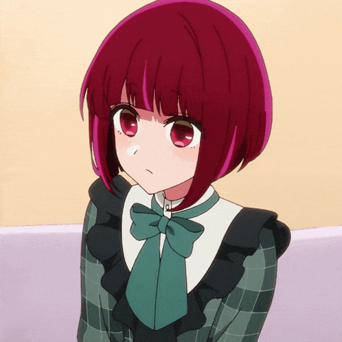 a girl with red hair is wearing a green and black dress