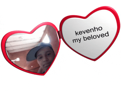 a heart shaped mirror with the words " kevinho my beloved " on it
