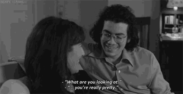 a man and a woman are looking at each other and the man says " what are you looking at "