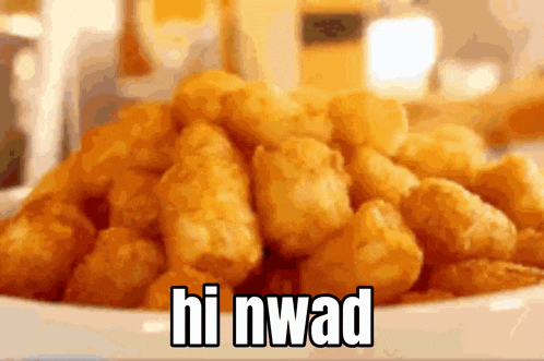 a pile of fried potatoes with the words `` hi nwad '' written on them .