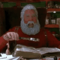 a man with a beard is sitting at a table holding a knife