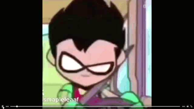 a close up of a robin cartoon character holding a pair of scissors .