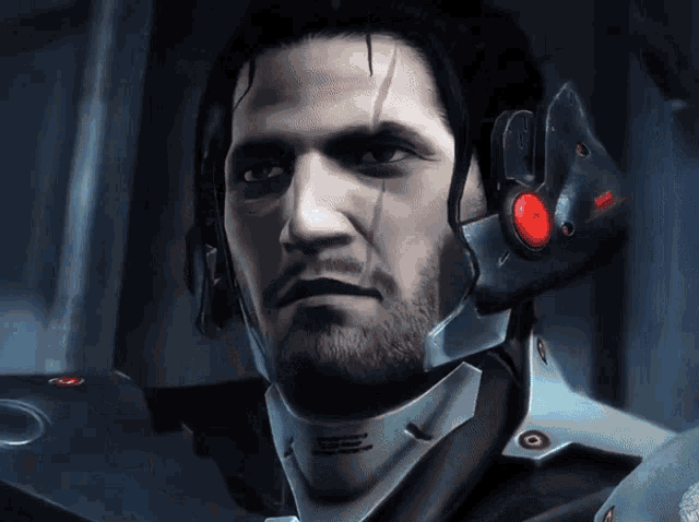 a man with a beard is wearing a helmet with a red light on his ear