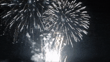a fireworks display is going off in the dark