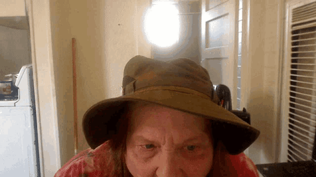 a man wearing a hat that says ' a ' on it