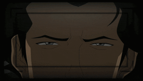 a close up of a man 's face with a serious look on his face