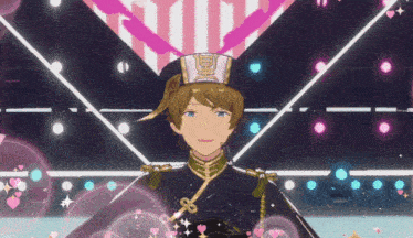 a man in a hat is standing on a stage in front of a pink heart .