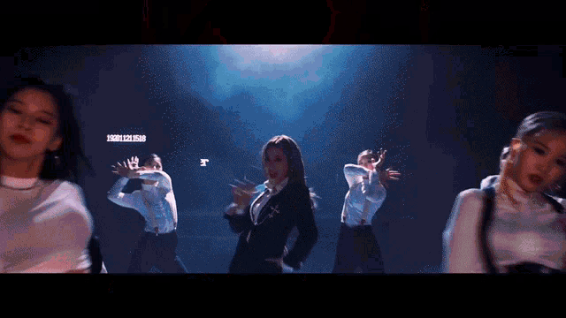 a group of dancers are performing in front of a screen that says ' hsbc '
