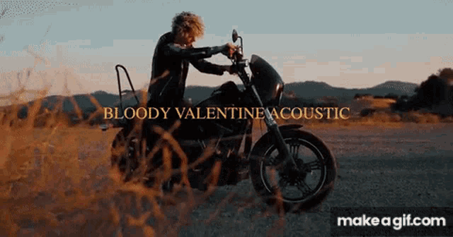 a man is riding a motorcycle with the words bloody valentine acoustic on it