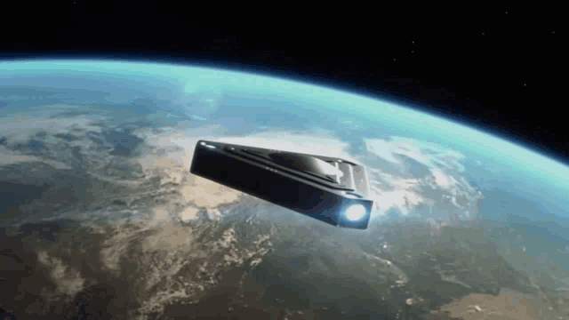 a space ship is flying over the earth with a light on the side