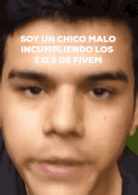 a close up of a man 's face with the caption soy un chico malo incumpliendo los t.o.s