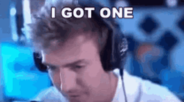a man wearing headphones is playing a video game .