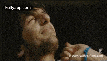 a close up of a man 's face with the words kulfyapp.com written on the bottom