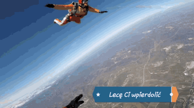 a man is flying through the air with a sign that says lece ci wpierdolic