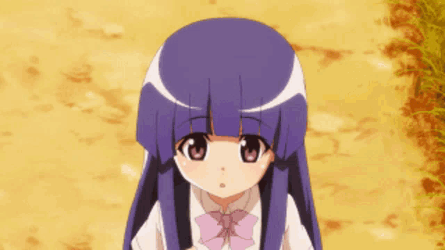 a little girl with purple hair and a pink bow