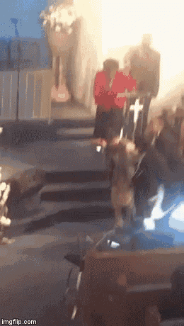 a blurry picture of a group of people standing on stairs in a church