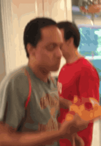 a blurry picture of a man wearing a shirt that says ' gear '