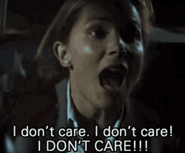 a woman with her mouth open says i don 't care i don 't care i don 't care !!