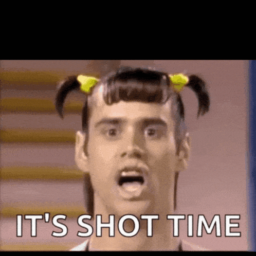 a man with pigtails and the words it 's shot time