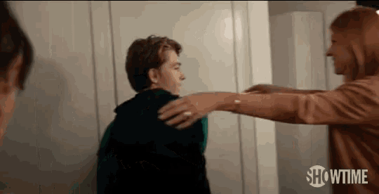 a woman is hugging a young man in a showtime ad .