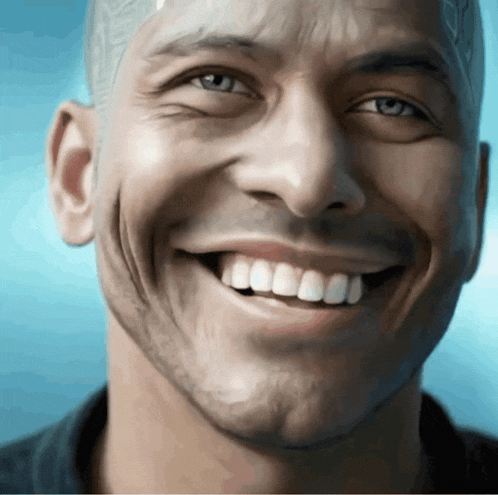 a close up of a man 's face with his teeth showing