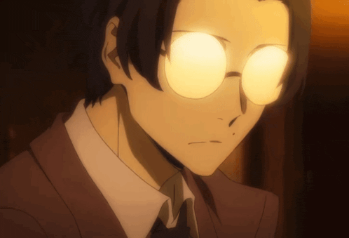 a close up of a man 's face with glowing glasses