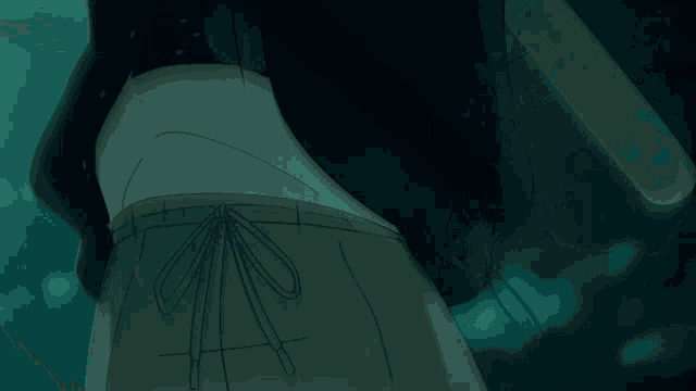 a man is holding a large sword in his hand in a dark room