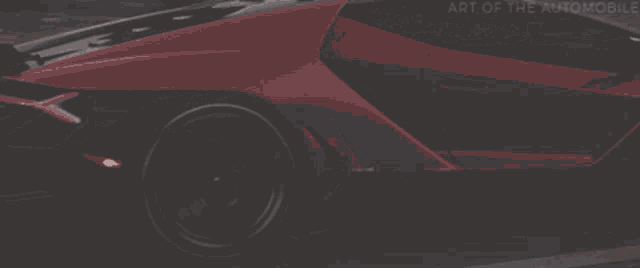 a red sports car is driving down a desert road with art of the automobile written on the bottom right