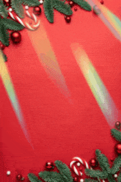 a red background with christmas decorations and a rainbow