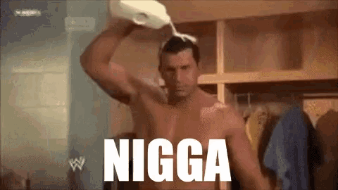 a shirtless man is pouring milk on his head with the word nigga written below him