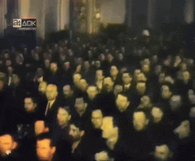 a crowd of people are gathered in front of a sign that says 24 aok