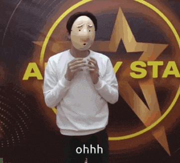 a man wearing a mask is standing in front of an all star sign