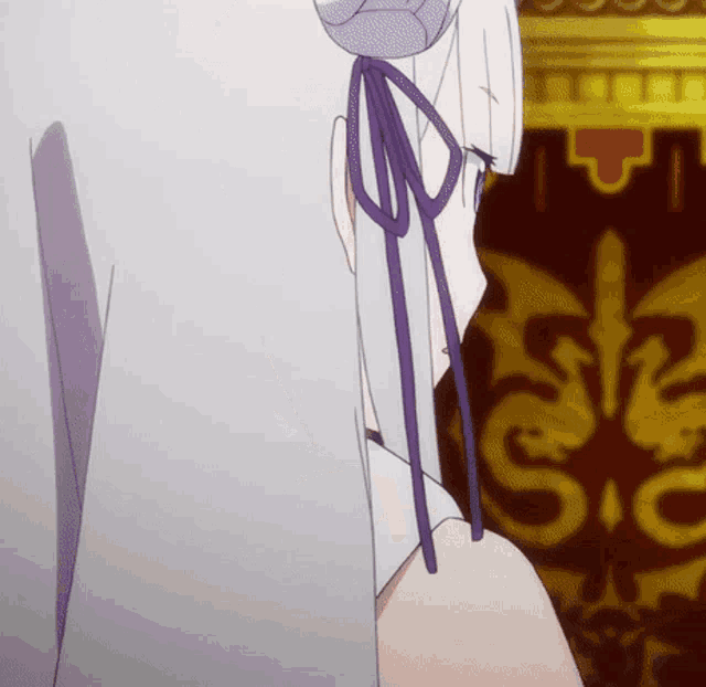 a woman with white hair and purple ribbons in her hair is standing in front of a wall with the letter s on it