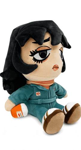 a stuffed doll with a heart on her chest sits on a white background