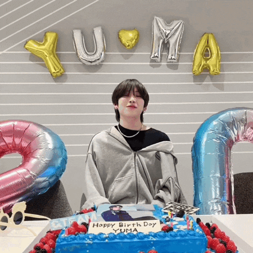 a birthday cake with a picture of yuma on it