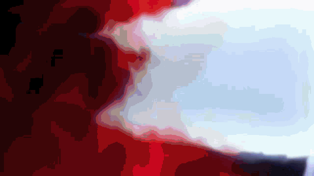 a red white and blue background with a blurred image