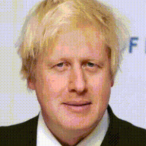 a close up of a man with blonde hair wearing a suit and tie .