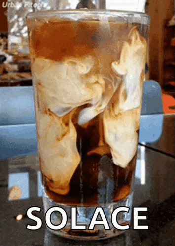 a glass of soda with the word solace on it