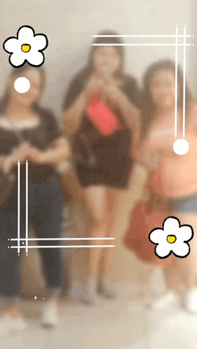a blurry picture of a group of women with a white flower in the middle