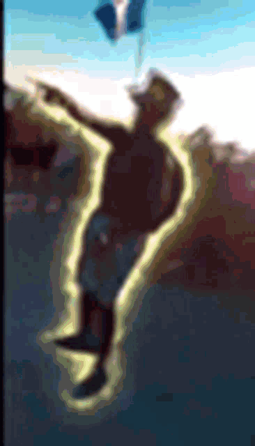 a man is flying through the air with a balloon .