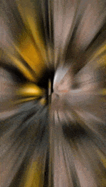 a blurry picture of a person 's face with a yellow and black background .
