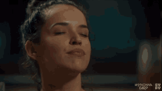 a close up of a woman 's face with the words wynton earp on the bottom right