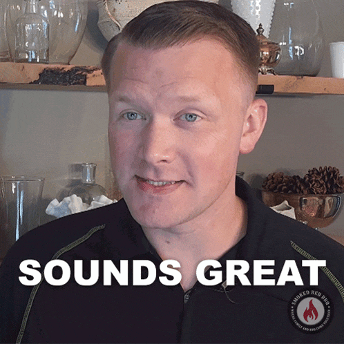a man wearing a black shirt with the words sounds great on it