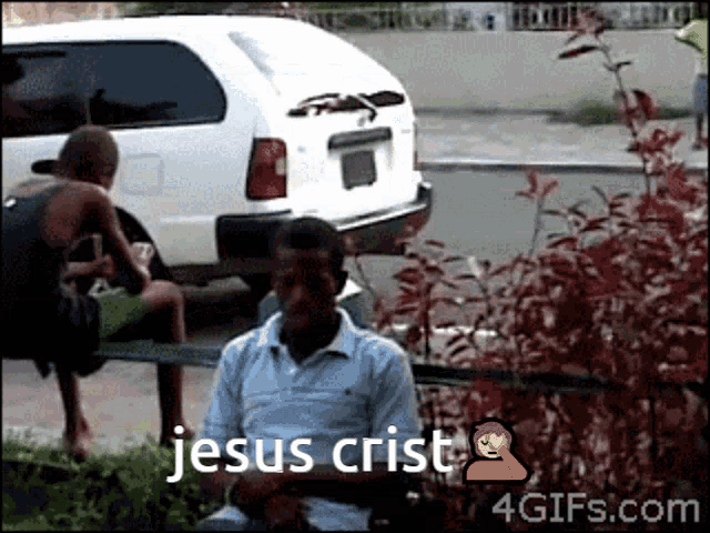 a man sits on a bench with the words jesus crist written on the bottom