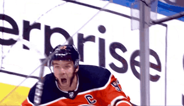a hockey player with the letter c on his chest