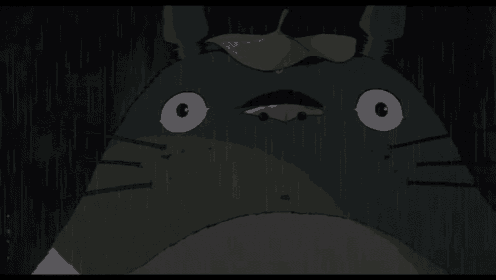 a close up of a cartoon character 's face with a leaf on its head .