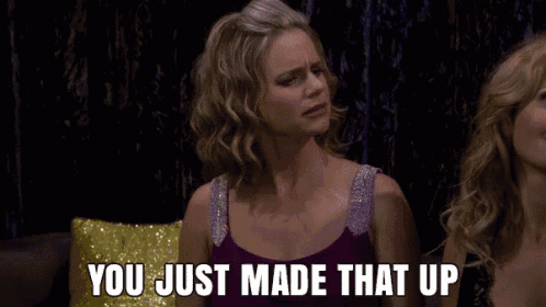 a woman in a purple dress is sitting next to another woman and says you just made that up .