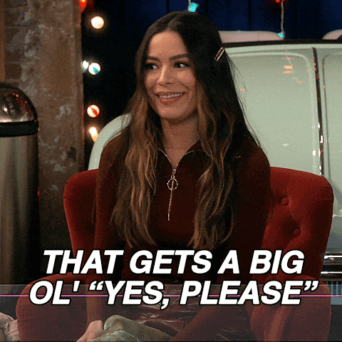a woman sits in a red chair with the words that gets a big ol " yes please "