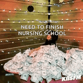 a woman is laying on a pile of money in a boxing ring with the words need to finish nursing school .